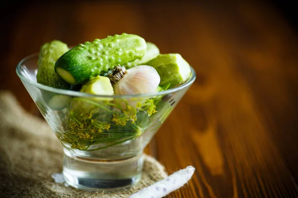 Pickled cucumbers in a glass bowl — Stock Photo, Image