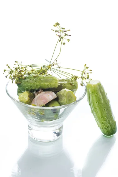 Pickled cucumbers in a glass bowl — Stock Photo, Image