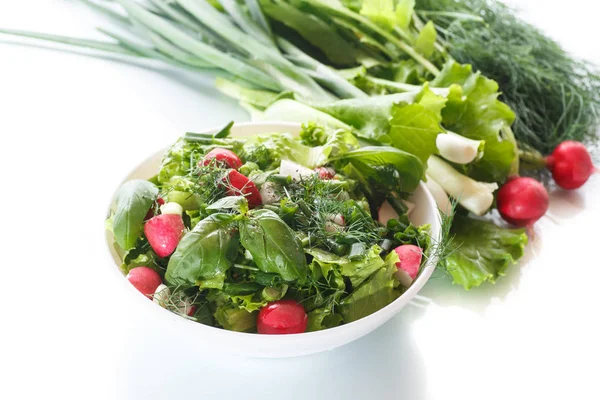 Spring salad from early vegetables, lettuce leaves, radishes and herbs — Stock Photo, Image