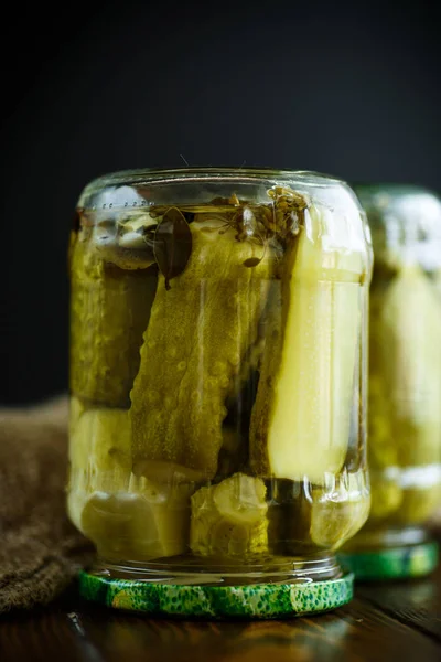 Home preservation. Canned in a glass jar ripe cucumber . — Stock Photo, Image