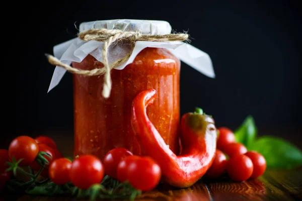 Homemade organic tomato sauce in a glass jar — Stock Photo, Image