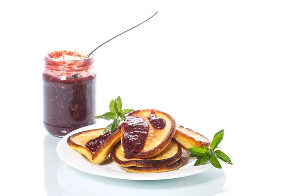 Sweet pancakes with raspberry jam — Stock Photo, Image
