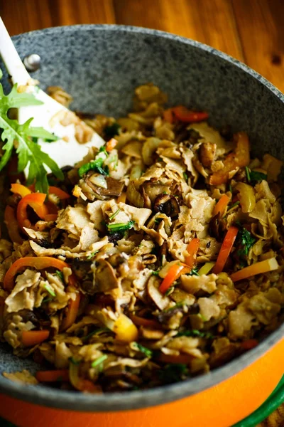 Buckwheat noodles with fried mushrooms and vegetables Stock Photo