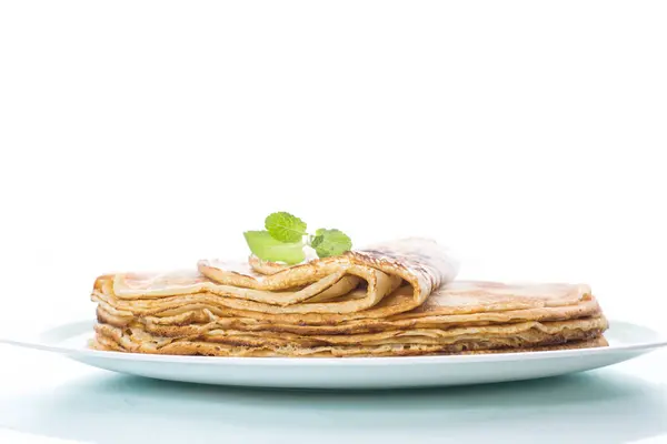 Thin delicious pancakes in a plate — Stock Photo, Image