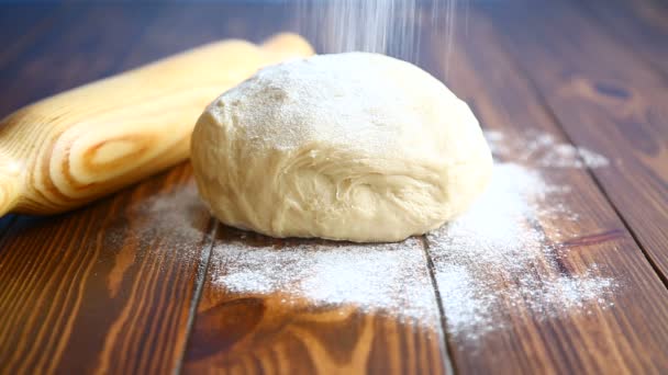 Fresh raw dough with a rolling pin — Stock Video