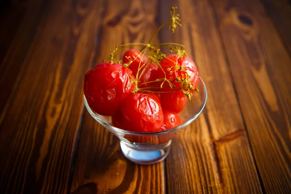 Ripe red marinated tomatoes in a glass bowl — Stock Photo, Image