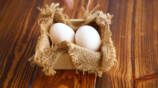 Box full of burlap with eggs — Stock Video