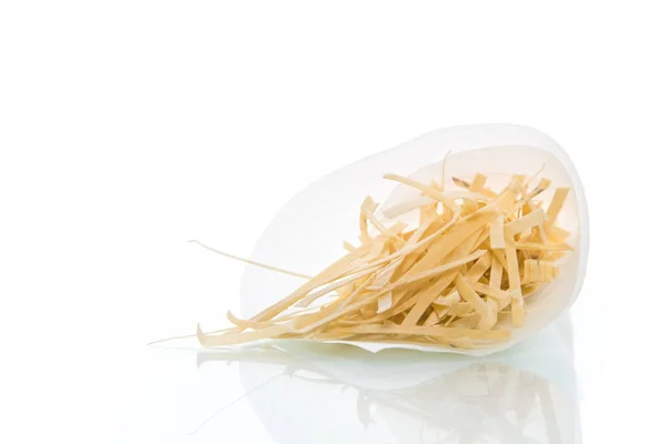 Homemade egg noodles in a paper package — Stock Photo, Image