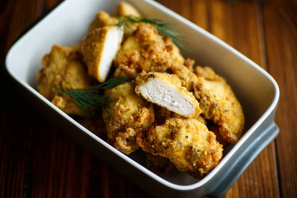 Chicken fried in batter with dill — Stock Photo, Image