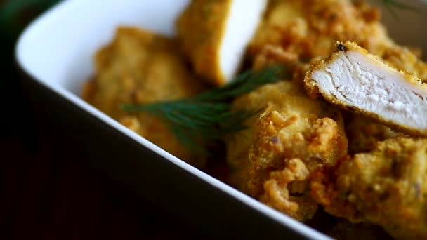 Chicken fried in batter with dill — Stock Video