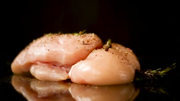 Chicken fillet with spices and rosemary on a dark — Stock Video
