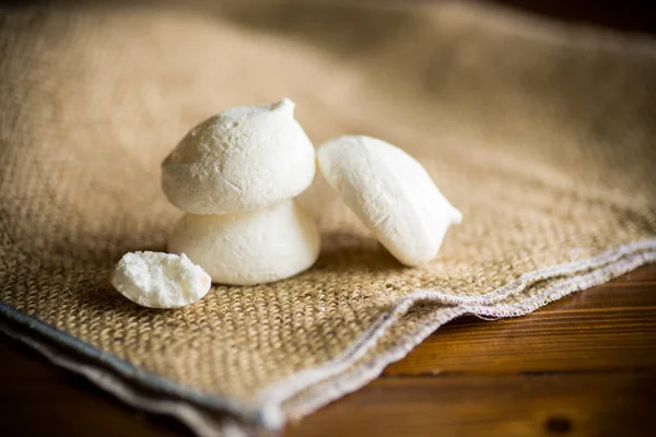 Sweet Tasty White Meringues Wooden Table Burlap Tablecloth — Stock Photo, Image