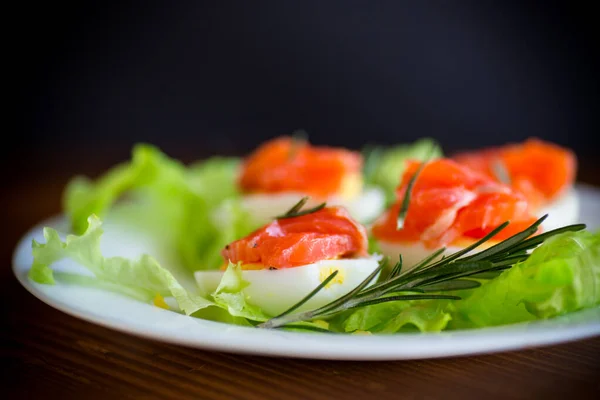 Boiled Eggs Salted Red Fish Salad Leaves Wooden Table — Stock Photo, Image