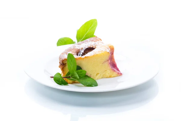 Sweet homemade casserole with fruits inside in a plate — Stock Photo, Image