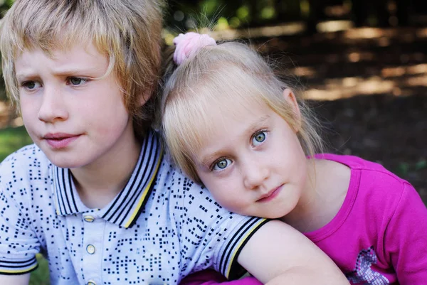 Portrait of girl with her brother — Stock Photo, Image