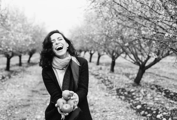 Woman holding apples