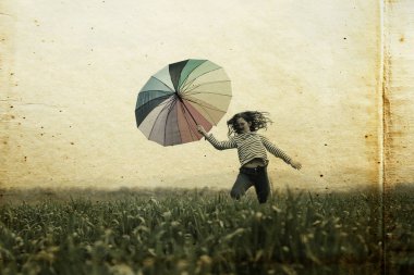 alanında atlama şemsiye ile kız 