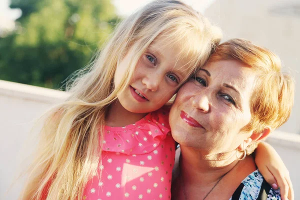 Portrait of grandmother with granddaughter — Stock Photo, Image