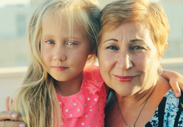 Portrait of grandmother with granddaughter — Stock Photo, Image