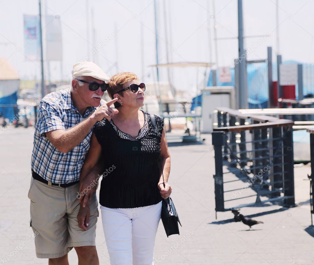 Portrait of senior couple walking outdoors