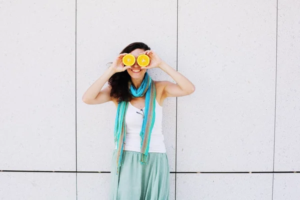 Portrait of smiling beautiful woman in turquoise skirt holding o — Stock Photo, Image