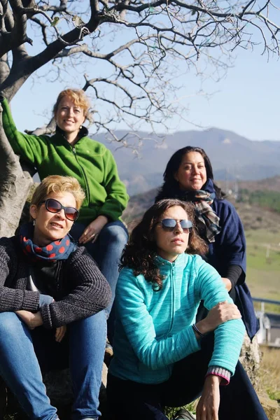 Outdoor portrait of happy 40 years old woman traveling together