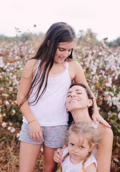 Portrait of beautiful mother with two daughters outdoors — Stock Photo, Image