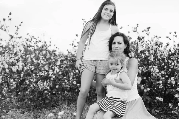 Portrait of beautiful mother with two daughters outdoors — Stock Photo, Image