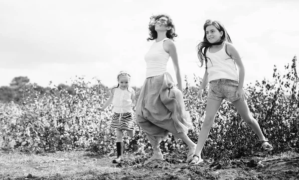 Portrait of beautiful mother with two daughters outdoors — Stock Photo, Image