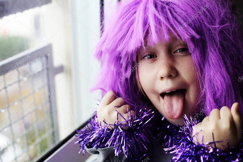 happy emotional child in carnival costume at home