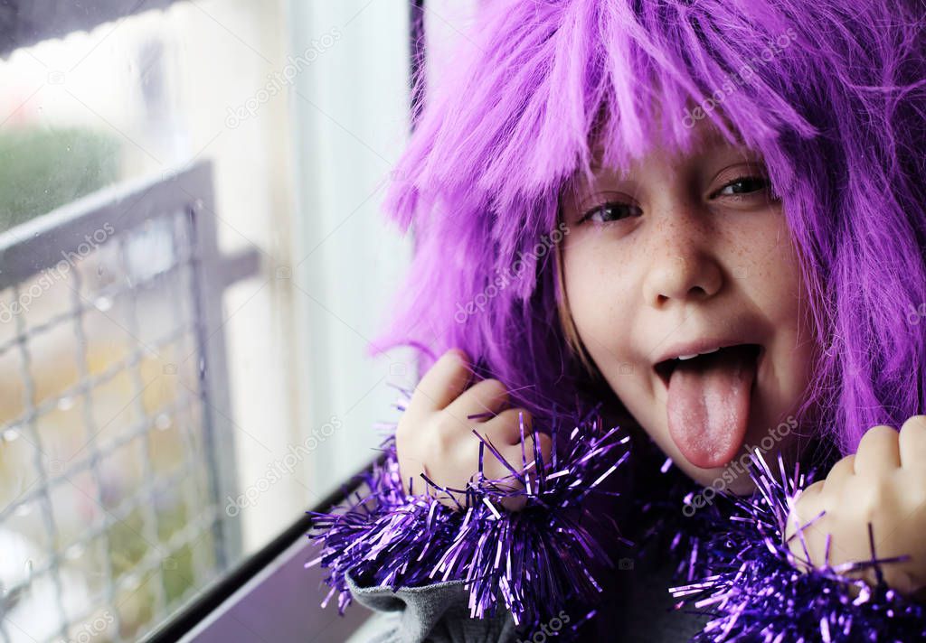 happy emotional child in carnival costume at home