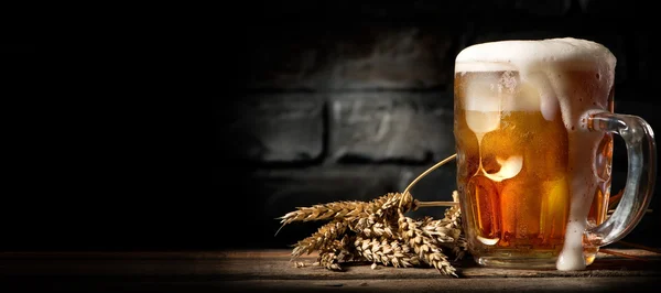 Beer in mug on table — Stock Photo, Image