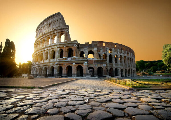 Colosseum and yellow sky in Rome, Italy