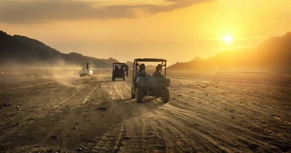 Buggy riding in desert — Stock Photo, Image