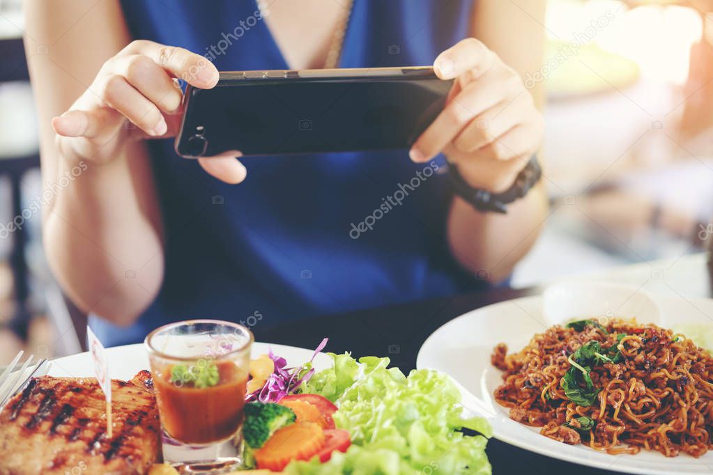 Close-up Woman's hands use pointing finger Mobile smart Phone on