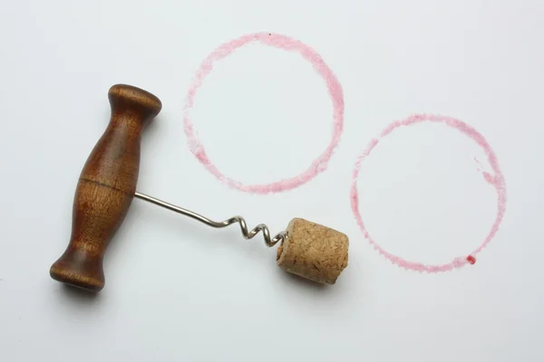 Corkscrew and cork on a white background — Stok fotoğraf