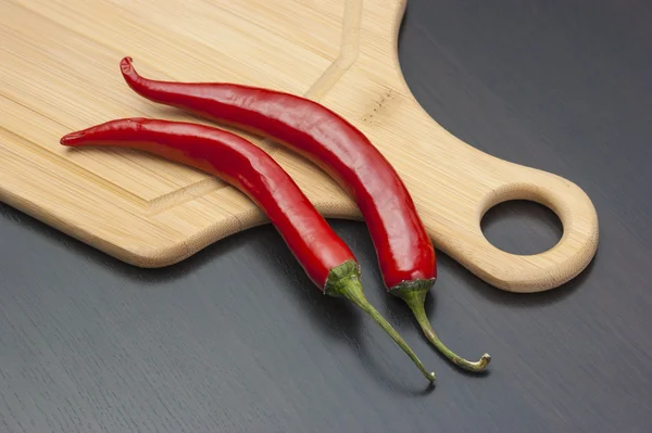 Capsicum and cooking utensils — Stock Photo, Image