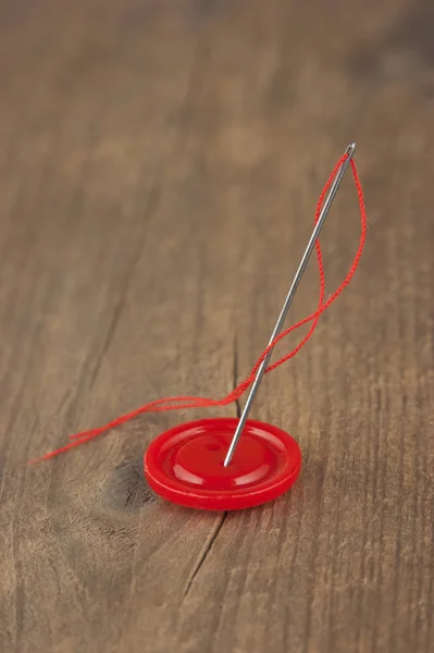 Buttons with needle and thread — Stock Photo, Image