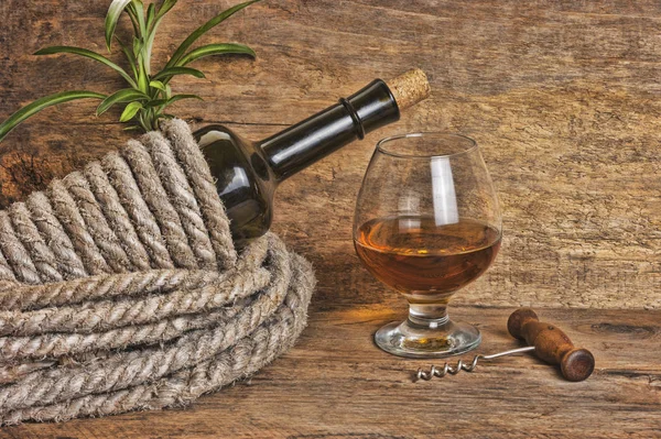 Bottle of wine wrapped with rope Royalty Free Stock Photos