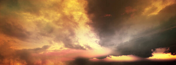 Dramatic sunset sky with tinted, colored clouds in summer season. Banner, Background, Drama,Twilight, tinted.