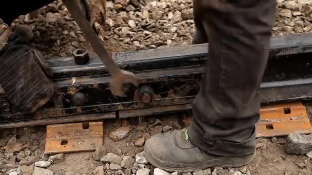 Railway workers bolting track rail — Stock Video