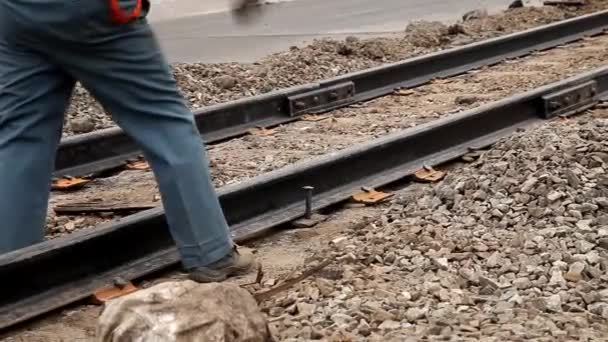 Railway workers bolting track rail — Stock Video