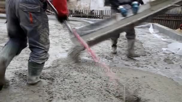 Pouring concrete mix from cement mixer on concreting formwork — Stock Video