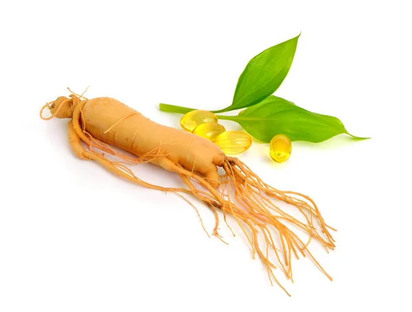 Ginseng root with pills and leawes. Isolated. — Stock Photo, Image