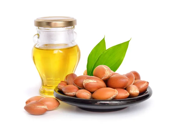 Argan seed with oil. Isolated. — Stock Photo, Image