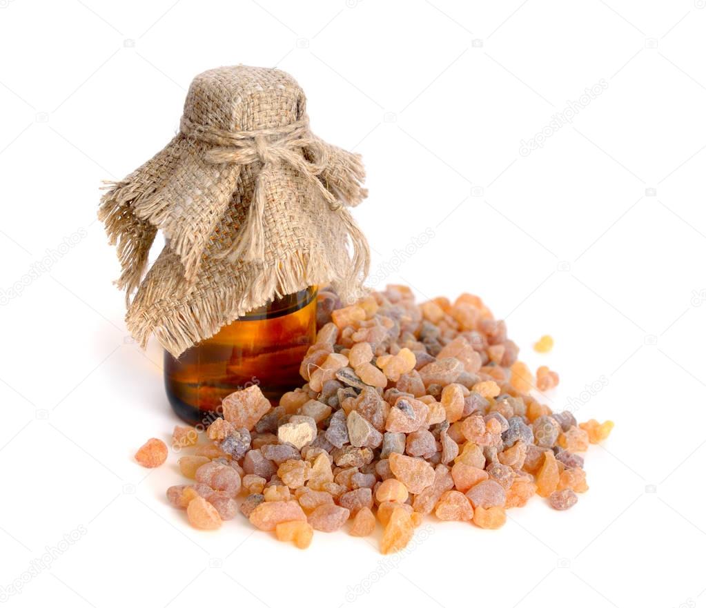 Frankincense olibanum resin with pharmaceutical bottle.