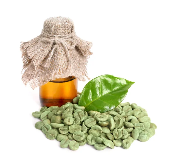 Green coffee beans with pharmaceutical bottle. — Stock Photo, Image