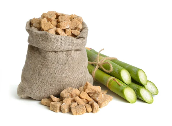 Sugar cane and brown sugar. Isolated on white background. — Stock Photo, Image