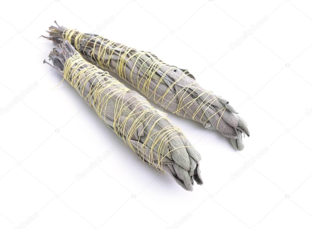 Sage smudge stick isolated on white background.