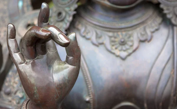 Detail of Buddha statue with Karana mudra hand position — Stock Photo, Image